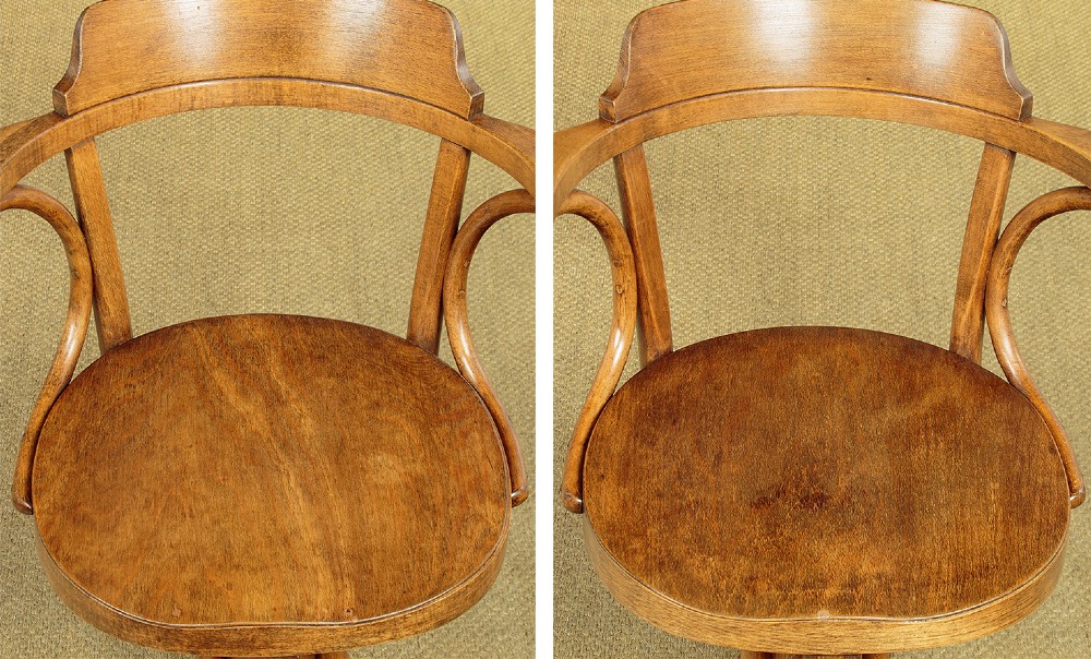A pair of antique warm brown bentwood swivel desk chairs with curved armrests and quadruped pedestal bases. View IV