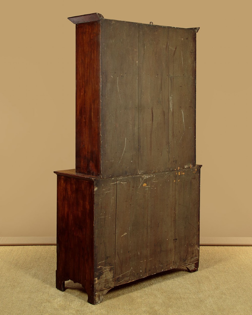 A Georgian Welsh oak cwpwrdd gwydr featuring a glazed upper section with two six-pane glass doors above three small drawers, resting on a base cabinet with two drawers over a panelled double cupboard. View XII