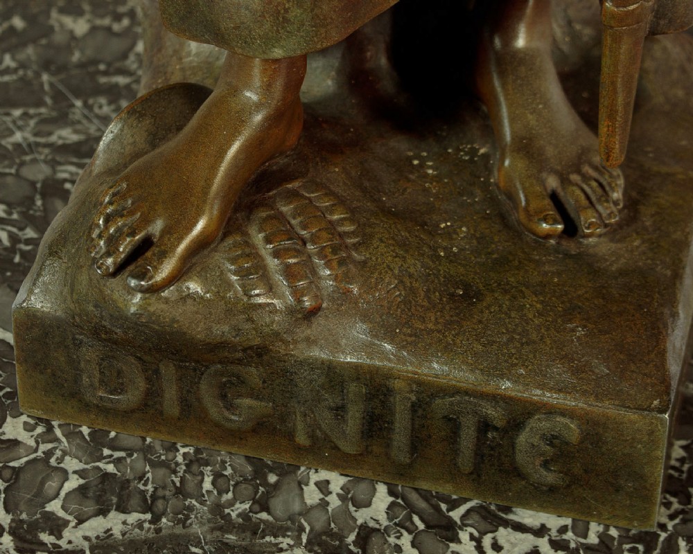 A patinated spelter statue of a standing female figure titled Dignite holding a sword and foliage branch, mounted on an integral square base. View XIII