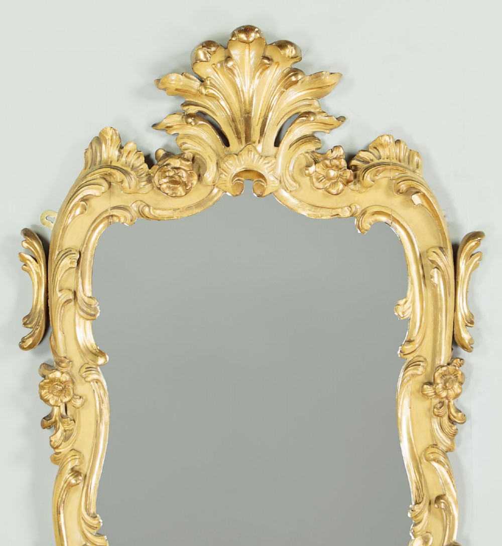 A small Rococo Revival gilded console table with a marble top, paired with an ornate matching carved wall mirror. View IV