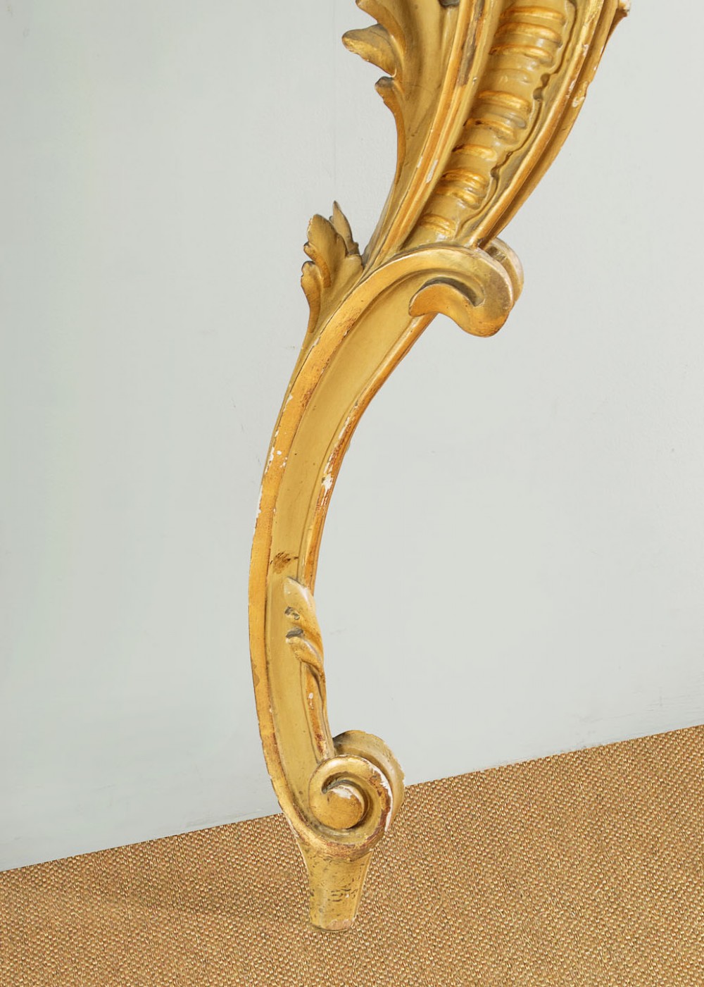 A small Rococo Revival gilded console table with a marble top, paired with an ornate matching carved wall mirror. View XI