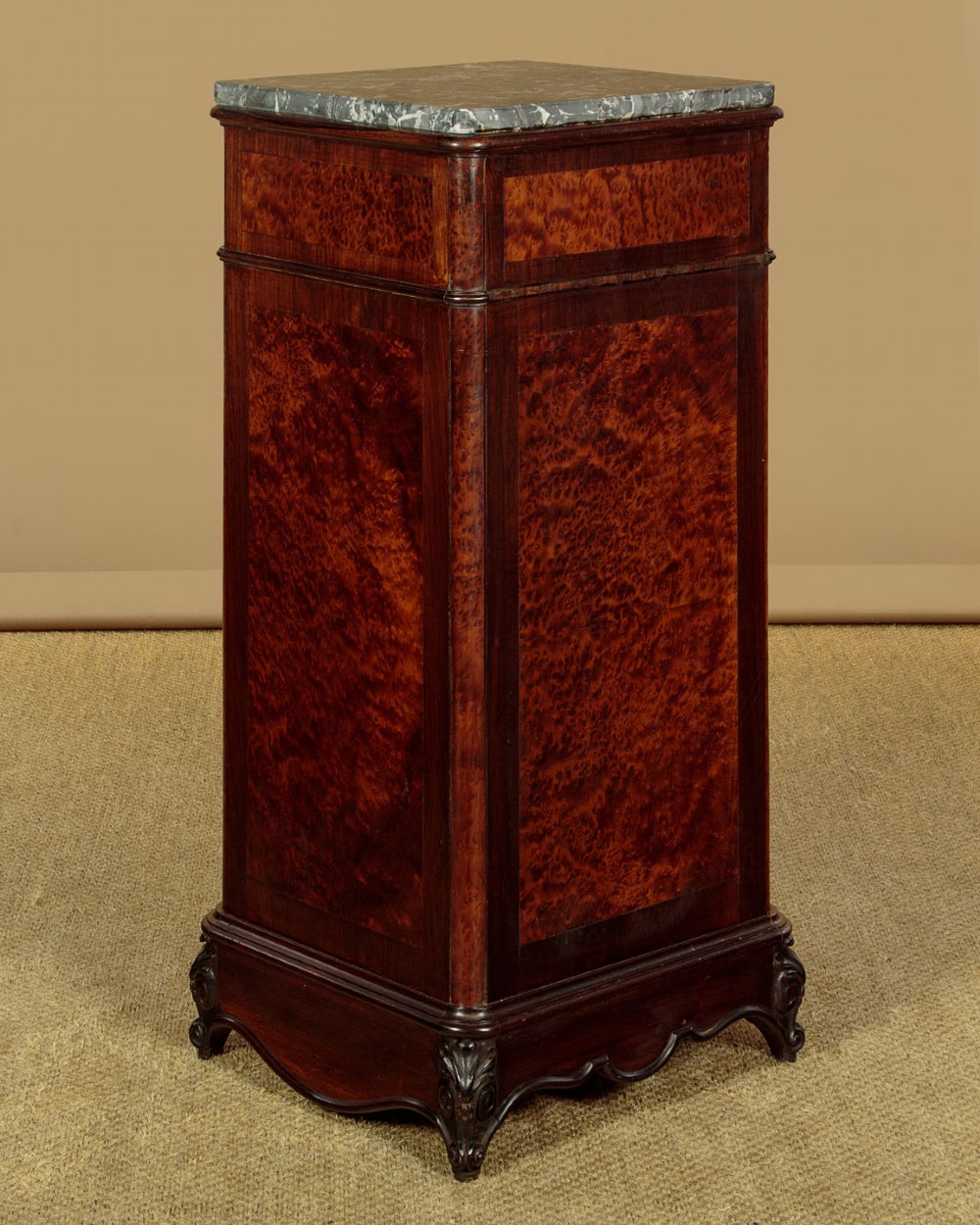 A pair of late Victorian dark rosewood and amboyna veneer tall bedside drawer pedestals featuring grey marble tops and turned wooden knobs. View XI