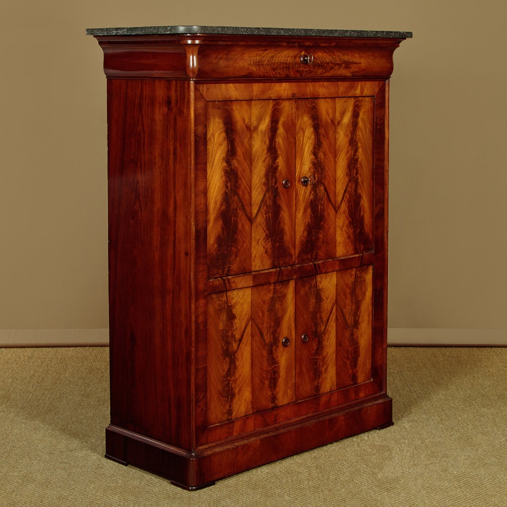 A 19th-century French Louis Philippe flame mahogany cabinet featuring a dark marble top, a frieze drawer, and four symmetrical veneered cupboard doors over a plinth base. View II