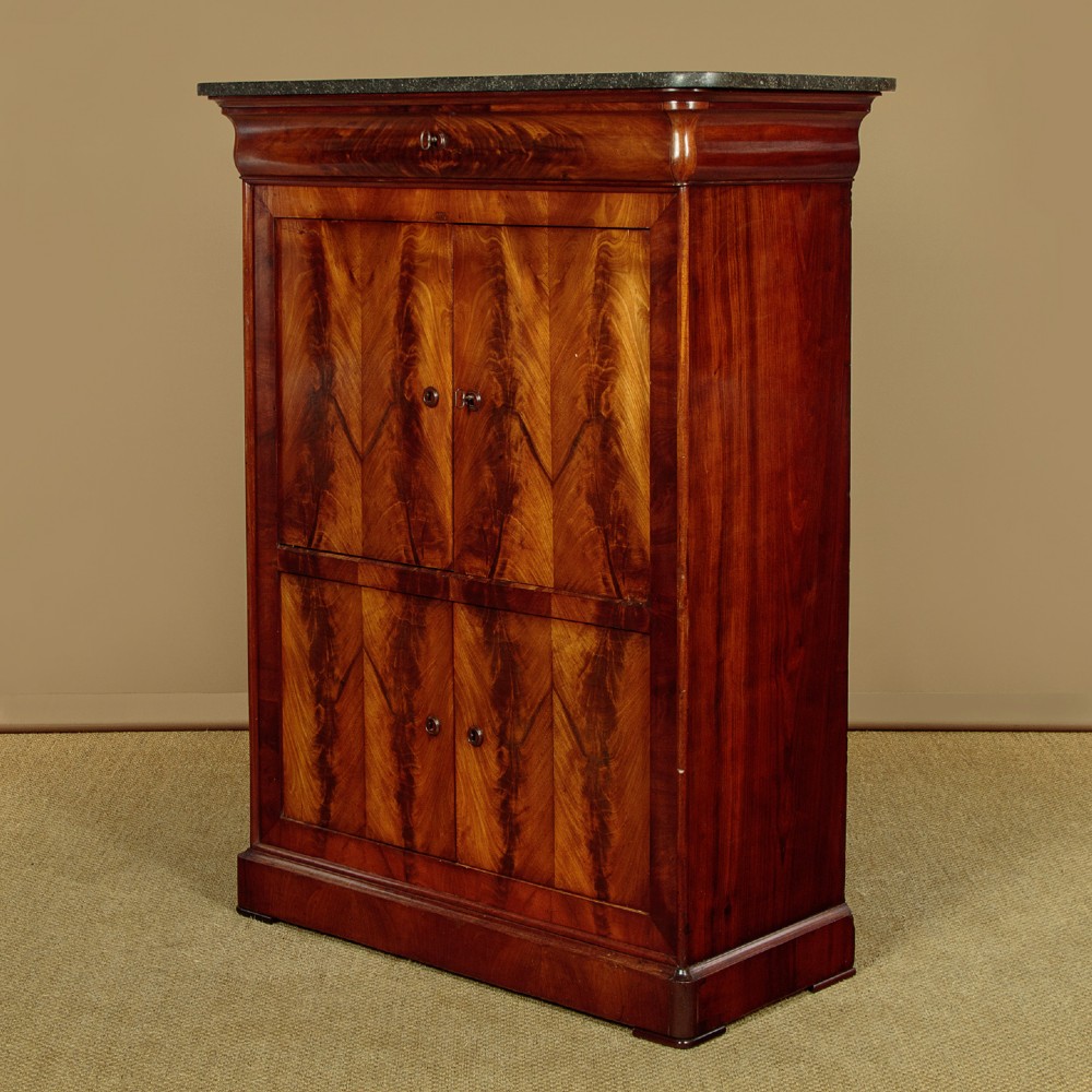 A 19th-century French Louis Philippe flame mahogany cabinet featuring a dark marble top, a frieze drawer, and four symmetrical veneered cupboard doors over a plinth base. View III