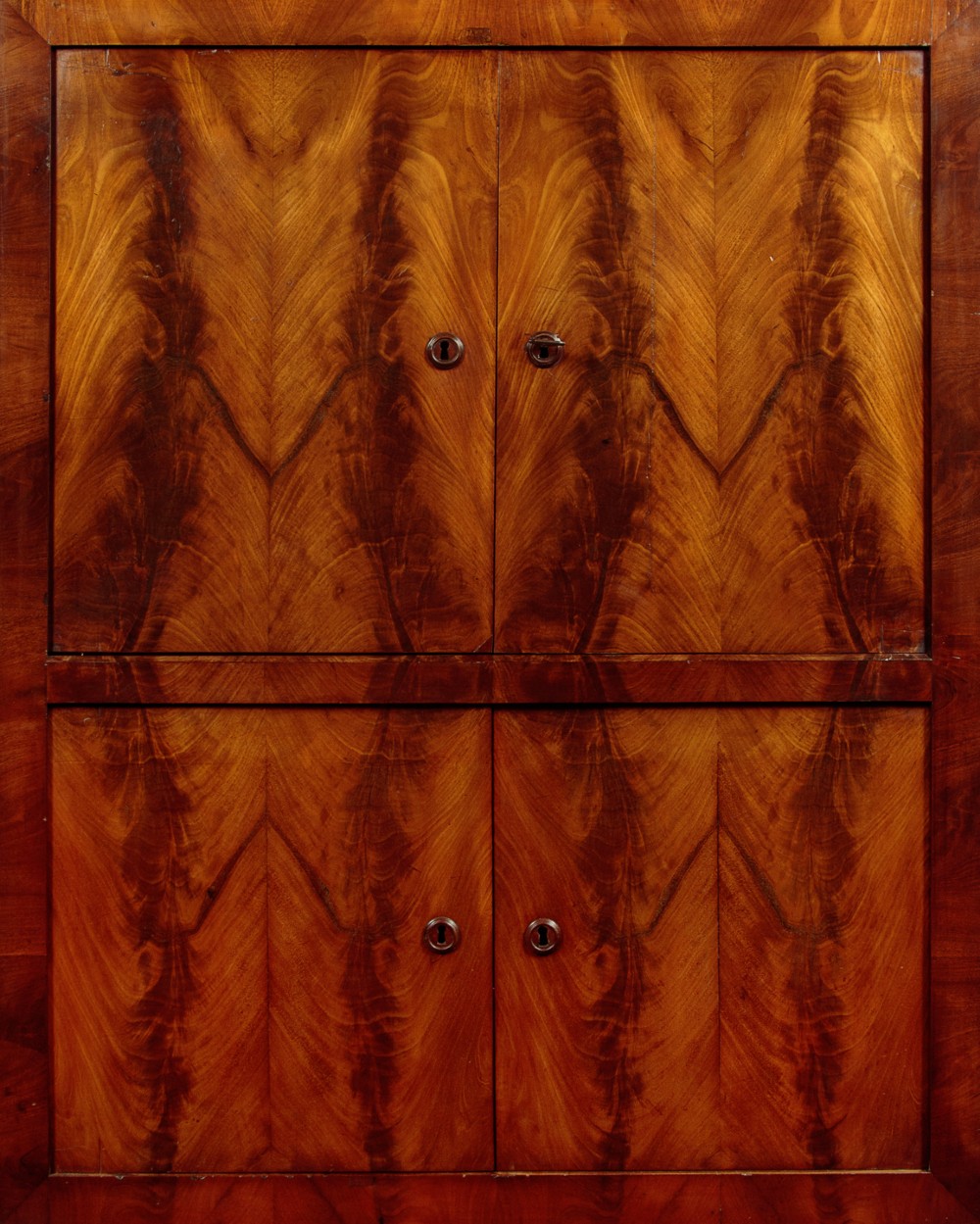 A 19th-century French Louis Philippe flame mahogany cabinet featuring a dark marble top, a frieze drawer, and four symmetrical veneered cupboard doors over a plinth base. View X