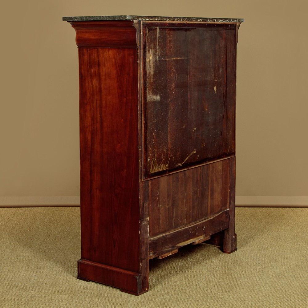 A 19th-century French Louis Philippe flame mahogany cabinet featuring a dark marble top, a frieze drawer, and four symmetrical veneered cupboard doors over a plinth base. View XIV