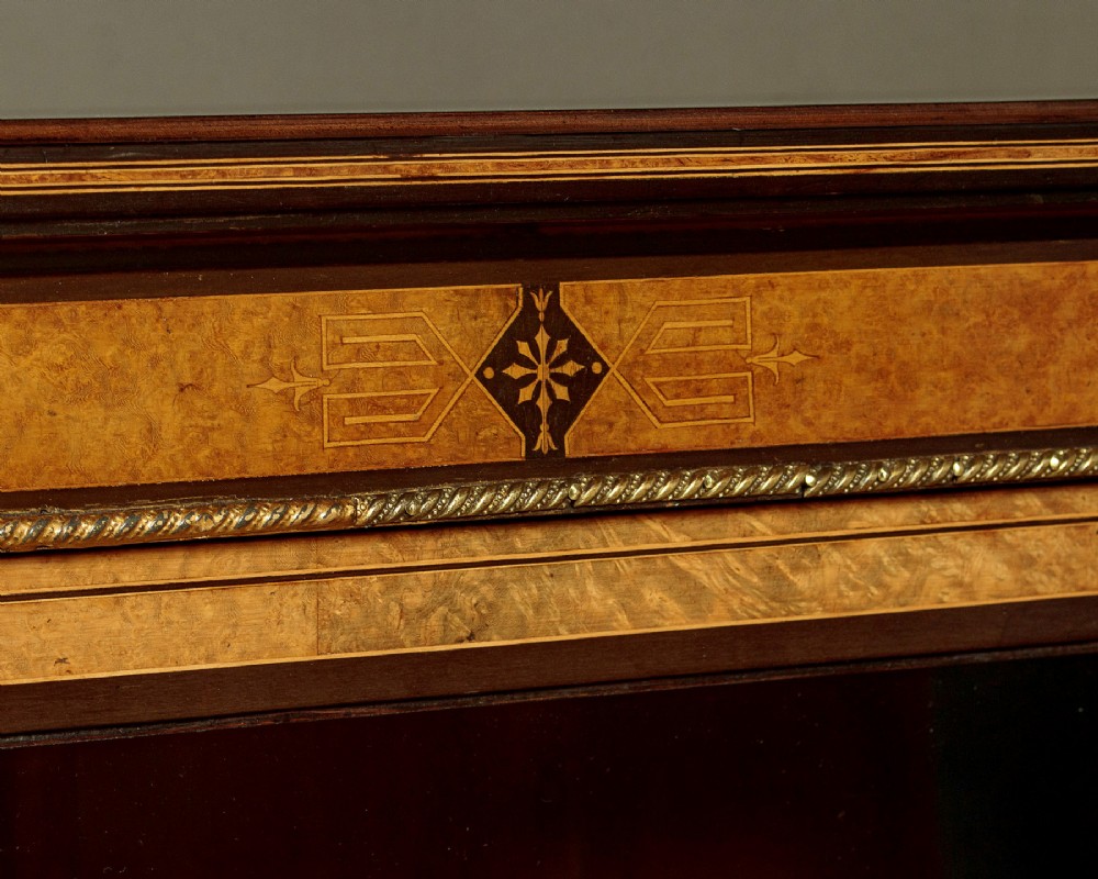 A late Victorian ebonised and burr walnut credenza featuring a central glazed door flanked by two curved side display glass doors with fluted column supports. View VII