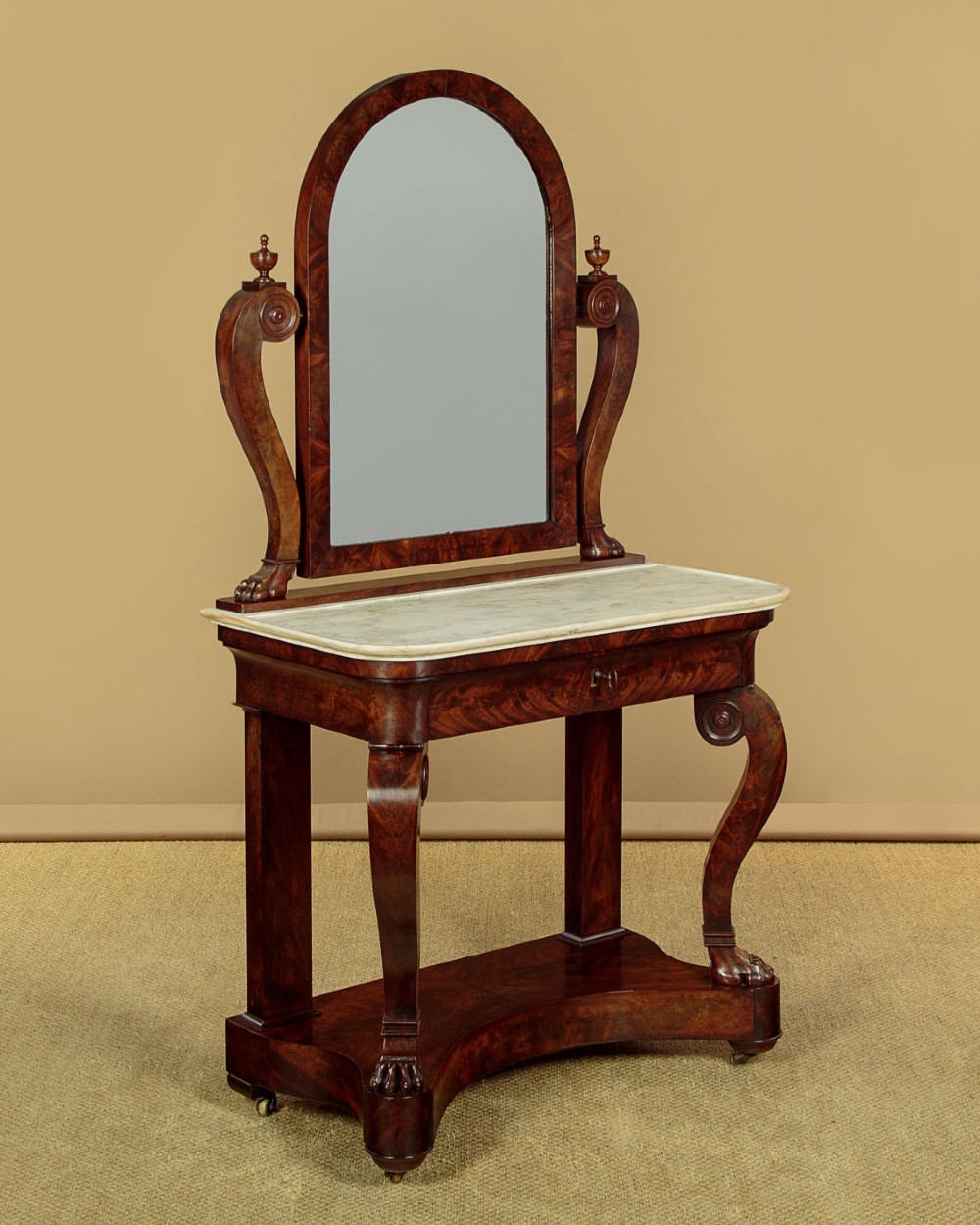 A mid-19th-century mahogany dressing table featuring a white marble surface, arched swing mirror on carved scroll supports, and lower plinth base. View III