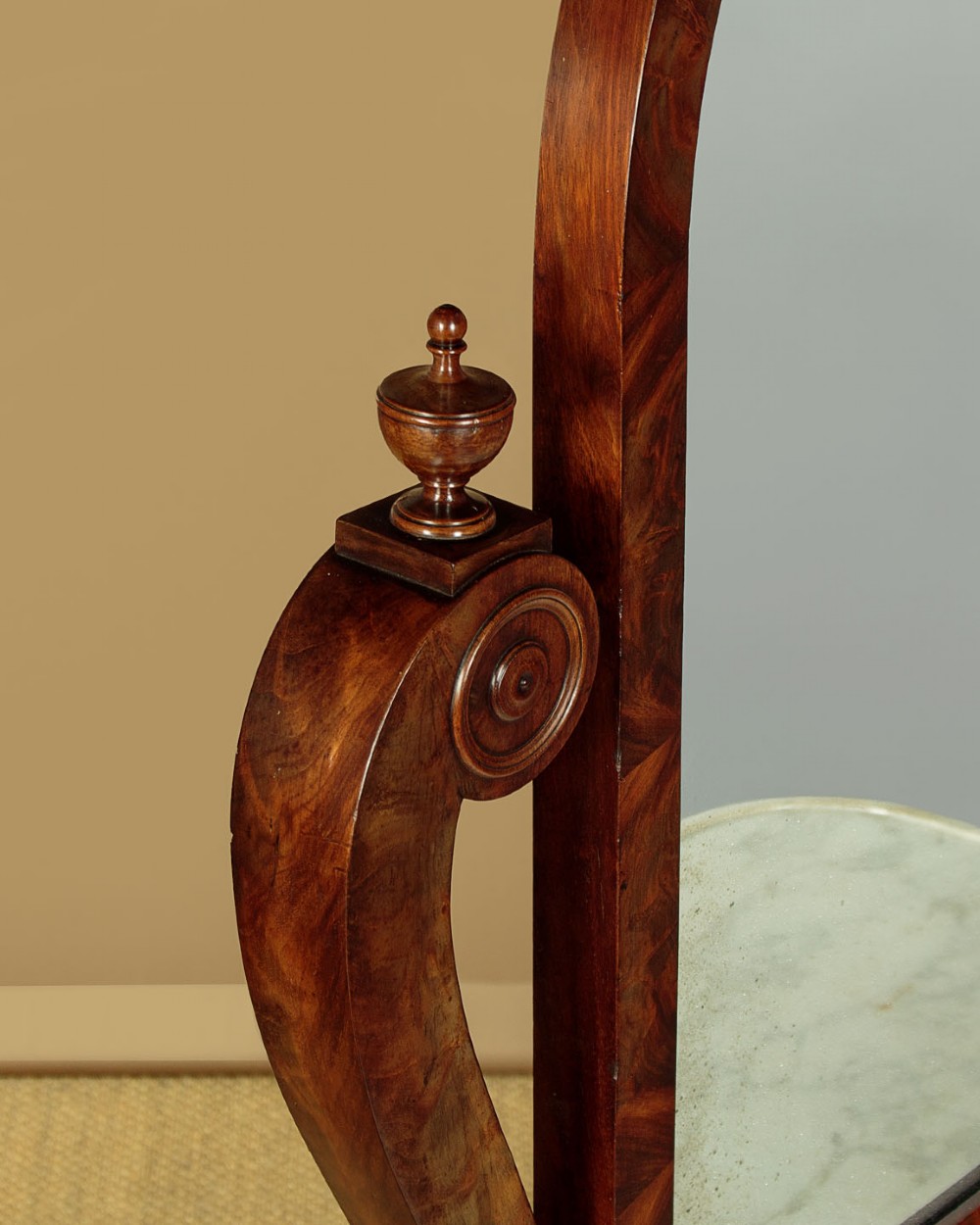 A mid-19th-century mahogany dressing table featuring a white marble surface, arched swing mirror on carved scroll supports, and lower plinth base. View VI