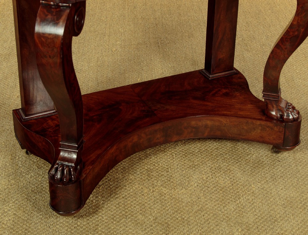 A mid-19th-century mahogany dressing table featuring a white marble surface, arched swing mirror on carved scroll supports, and lower plinth base. View XII