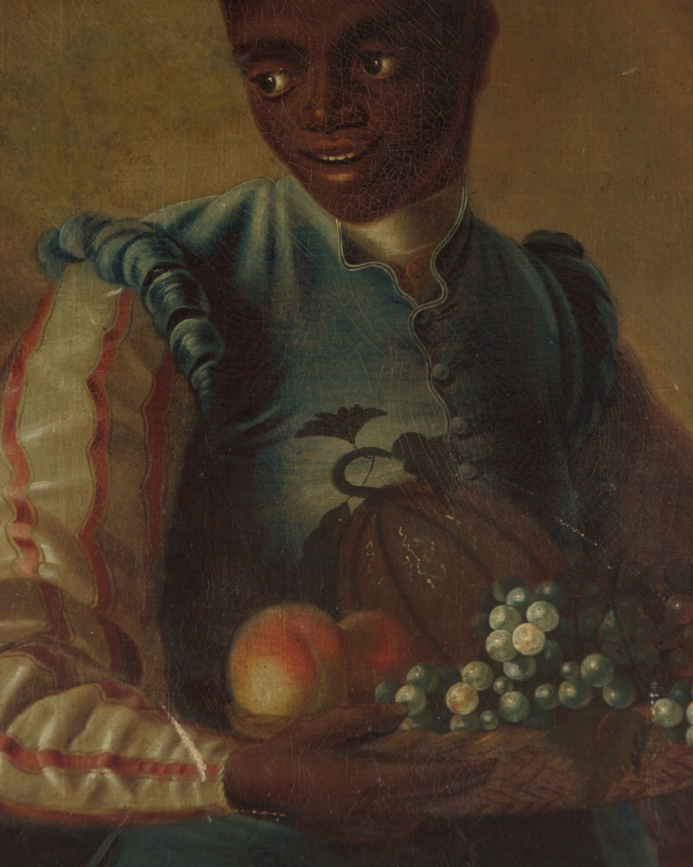 A Georgian style oil painting depicting a young servant holding a fruit basket containing grapes and a melon, dressed in a blue waistcoat. View VI