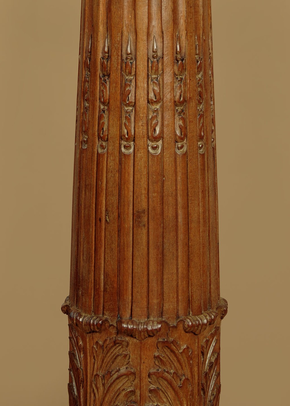 A pair of carved walnut standard lamps featuring fluted tapered shafts, acanthus scroll bases, and candle-style bulb sockets. View V