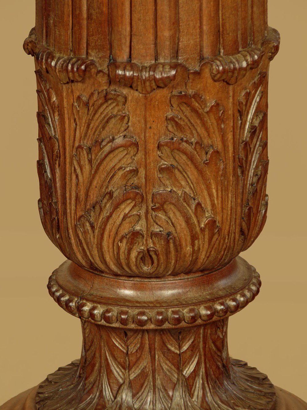 A pair of carved walnut standard lamps featuring fluted tapered shafts, acanthus scroll bases, and candle-style bulb sockets. View VI
