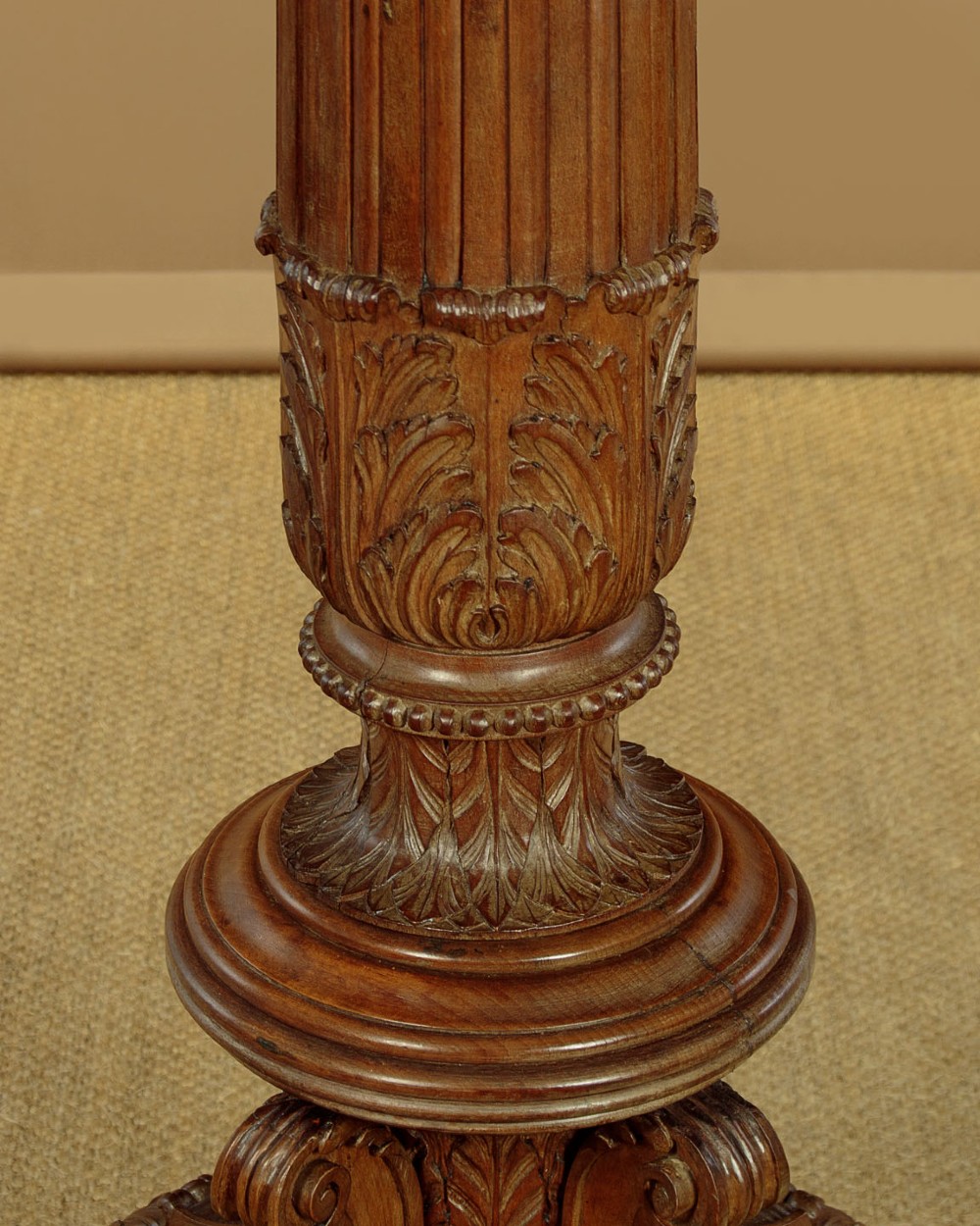 A pair of carved walnut standard lamps featuring fluted tapered shafts, acanthus scroll bases, and candle-style bulb sockets. View VII