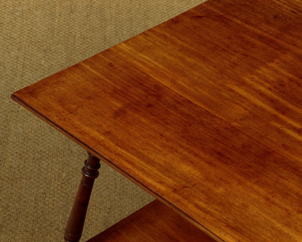 A square low Arts and Crafts style mahogany side table featuring turned splayed legs, a lower shelf, and decorative corner spandrels. View IV