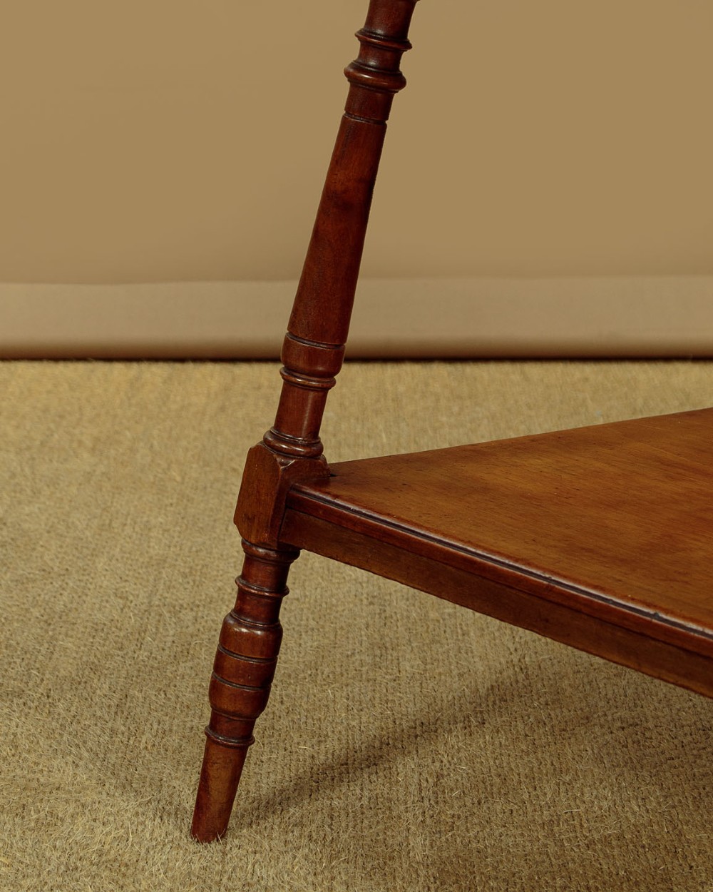 A square low Arts and Crafts style mahogany side table featuring turned splayed legs, a lower shelf, and decorative corner spandrels. View VII