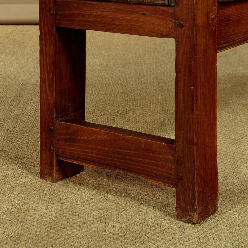 A small antique warm brown oak hall bench featuring a slatted open backrest, straight armrests, and a solid plank seat. View VIII