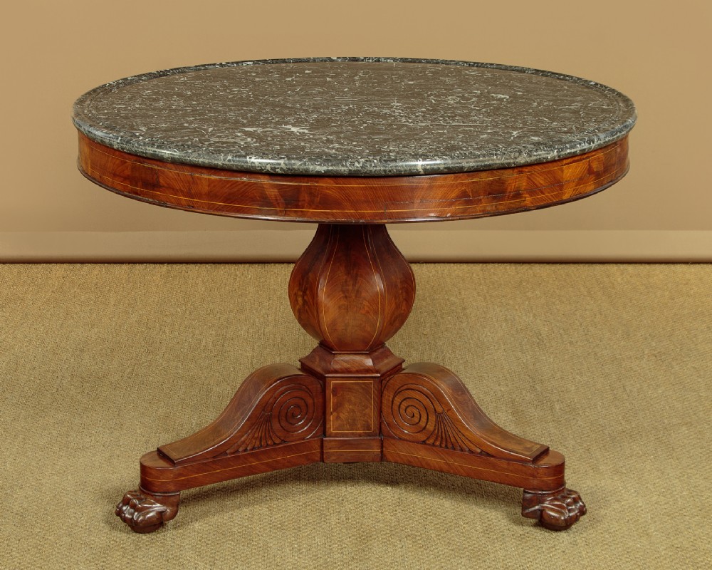 A 19th-century circular gueridon centre table featuring a dark grey marble top, warm walnut veneer with string inlay, a bulbous pedestal, and carved paw feet. View II