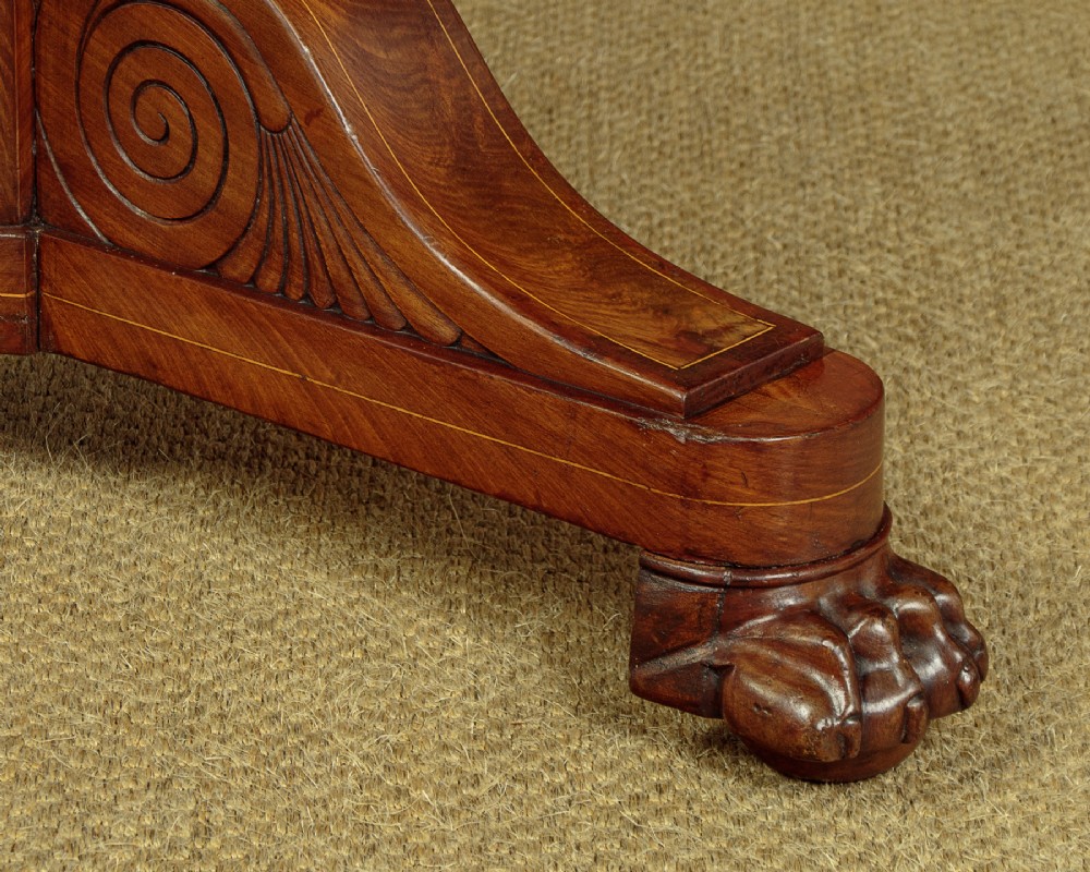 A 19th-century circular gueridon centre table featuring a dark grey marble top, warm walnut veneer with string inlay, a bulbous pedestal, and carved paw feet. View IX
