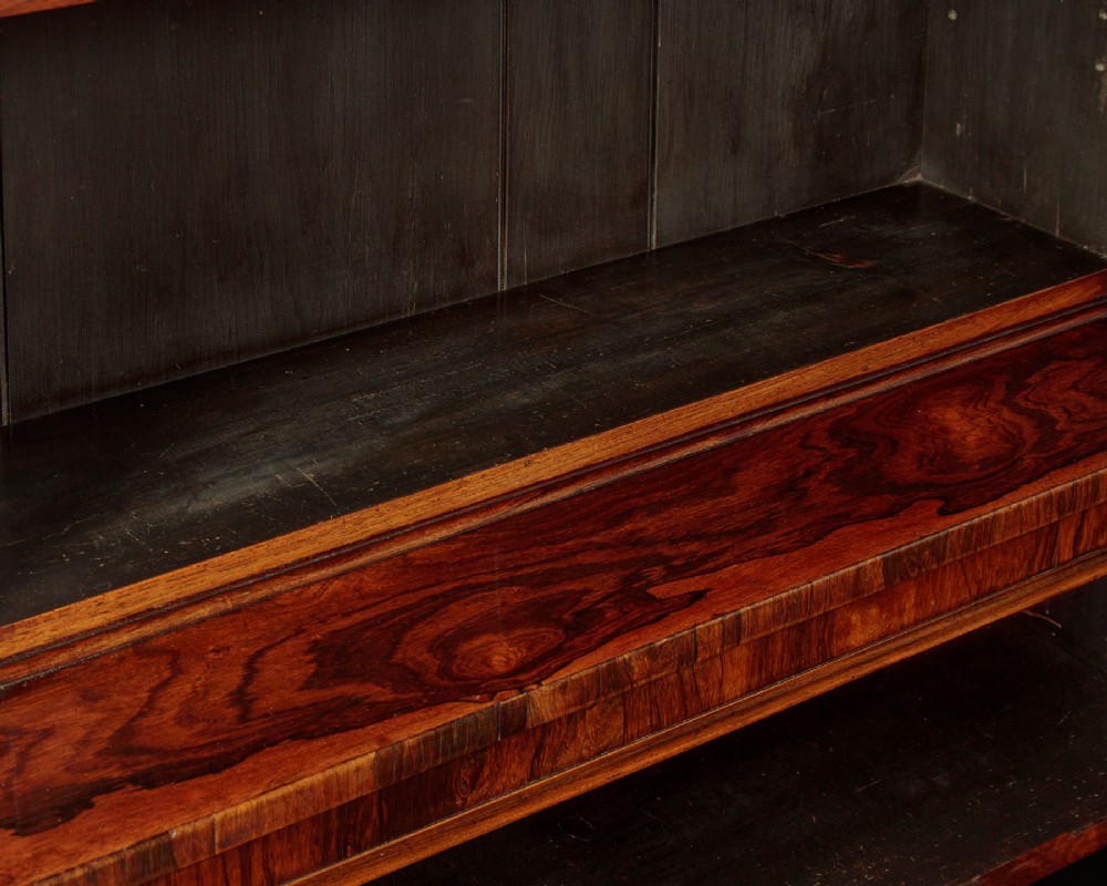 A mid-19th century dark rosewood open breakfront bookcase featuring a central projecting section flanked by narrower side shelves. View VIII