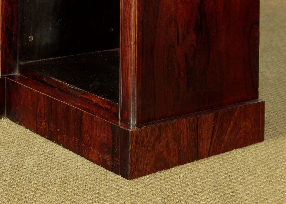 A mid-19th century dark rosewood open breakfront bookcase featuring a central projecting section flanked by narrower side shelves. View IX
