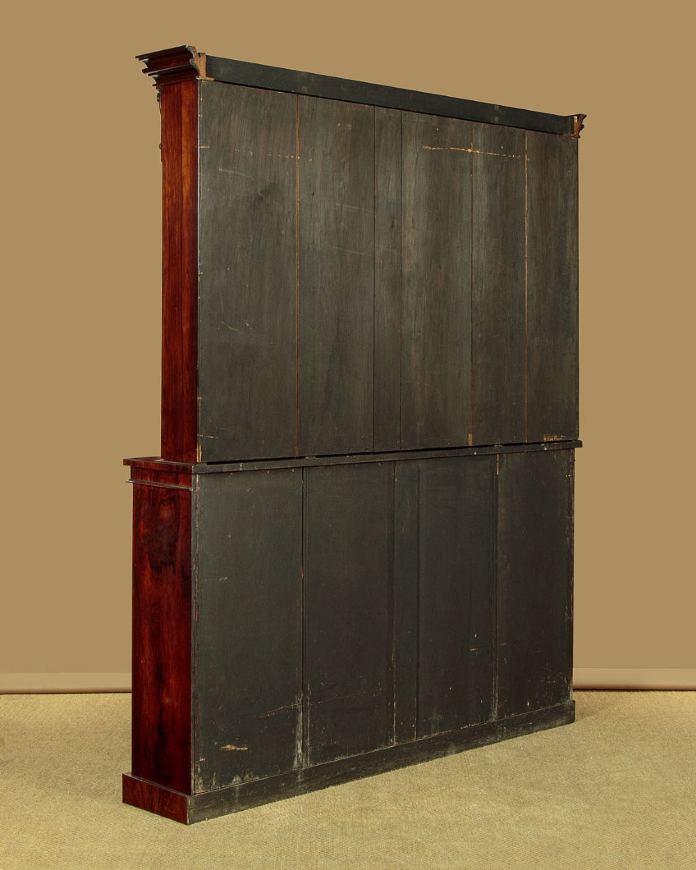 A mid-19th century dark rosewood open breakfront bookcase featuring a central projecting section flanked by narrower side shelves. View X