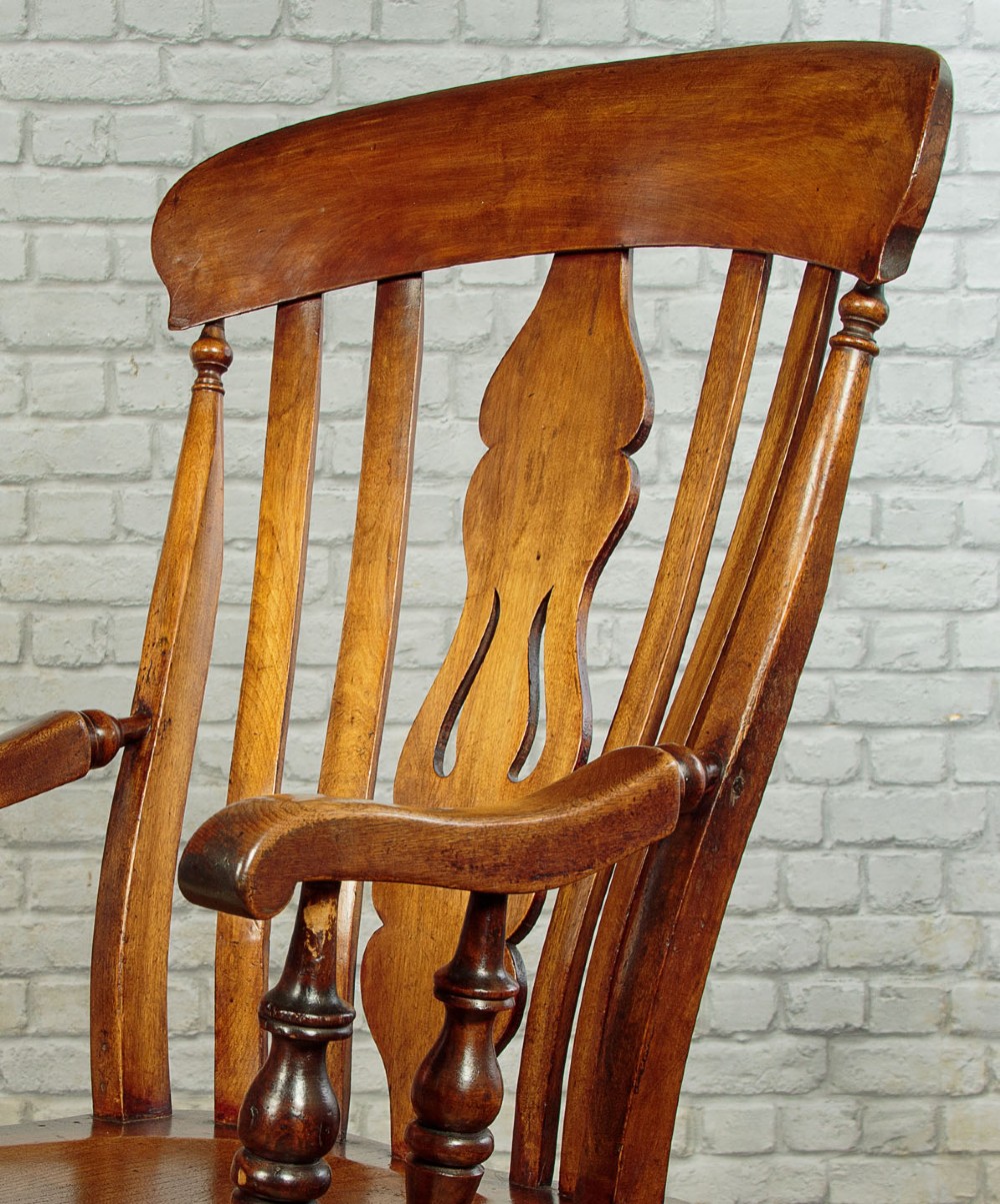 A Victorian highback wooden armchair featuring turned legs, curved armrests, a contoured seat, and a pierced back splat. View IV