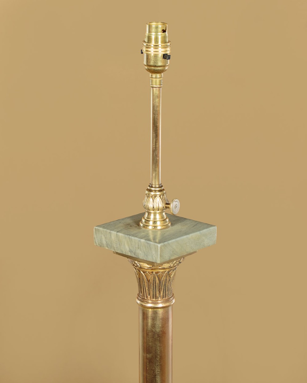 An adjustable French Empire style brass floor lamp featuring a fluted standard column set upon a grey marble base with brass claw feet. View IV