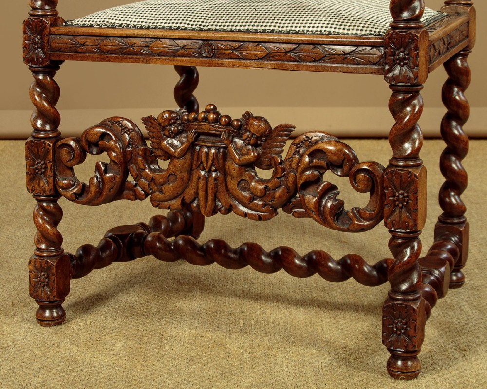 A pair of carved walnut armchairs featuring oval cane back panels, scroll armrests, and barley twist legs. View XIII