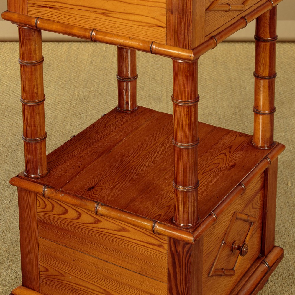 Late 19th-century faux bamboo wooden bedside cabinet featuring turned bamboo-style supports, an upper drawer with diamond moulding, an open shelf, and a lower drawer section. View VII