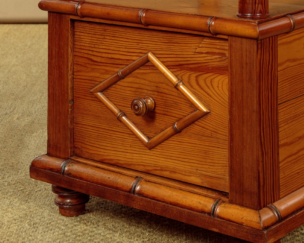 Late 19th-century faux bamboo wooden bedside cabinet featuring turned bamboo-style supports, an upper drawer with diamond moulding, an open shelf, and a lower drawer section. View VIII