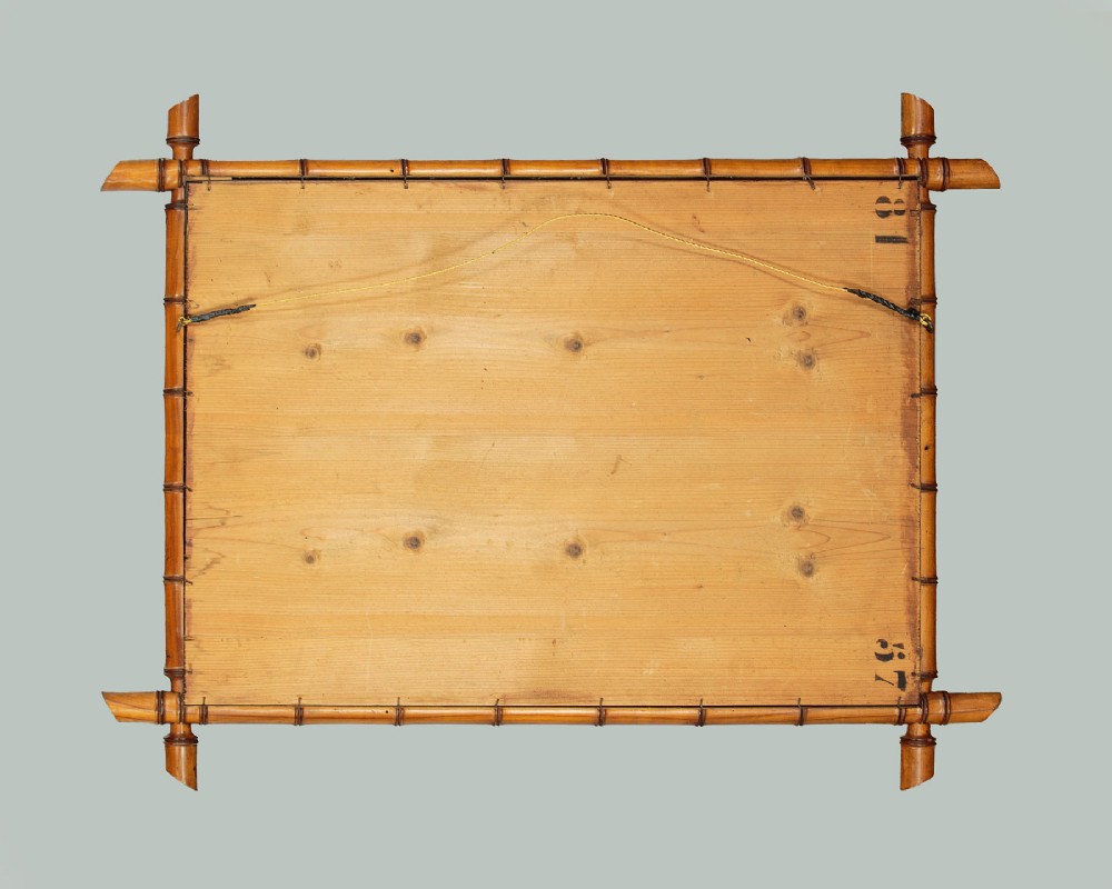 A late nineteenth-century rectangular wall mirror featuring a carved wooden frame that simulates natural bamboo with overlapping corner joints. View VIII