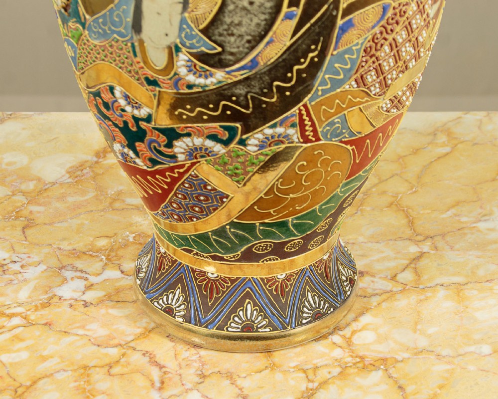 A pair of large Japanese Satsuma earthenware vases featuring hand-painted enamelled figures and high-relief gilded dragons wrapped around the necks. View XIII