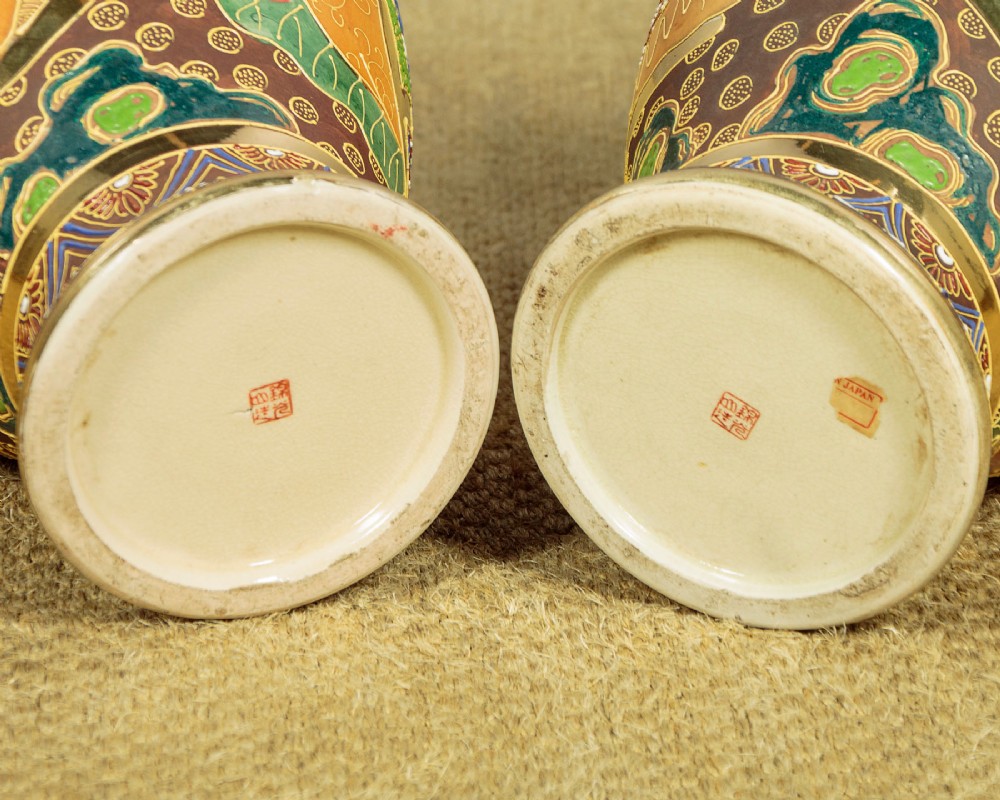 A pair of large Japanese Satsuma earthenware vases featuring hand-painted enamelled figures and high-relief gilded dragons wrapped around the necks. View XIV