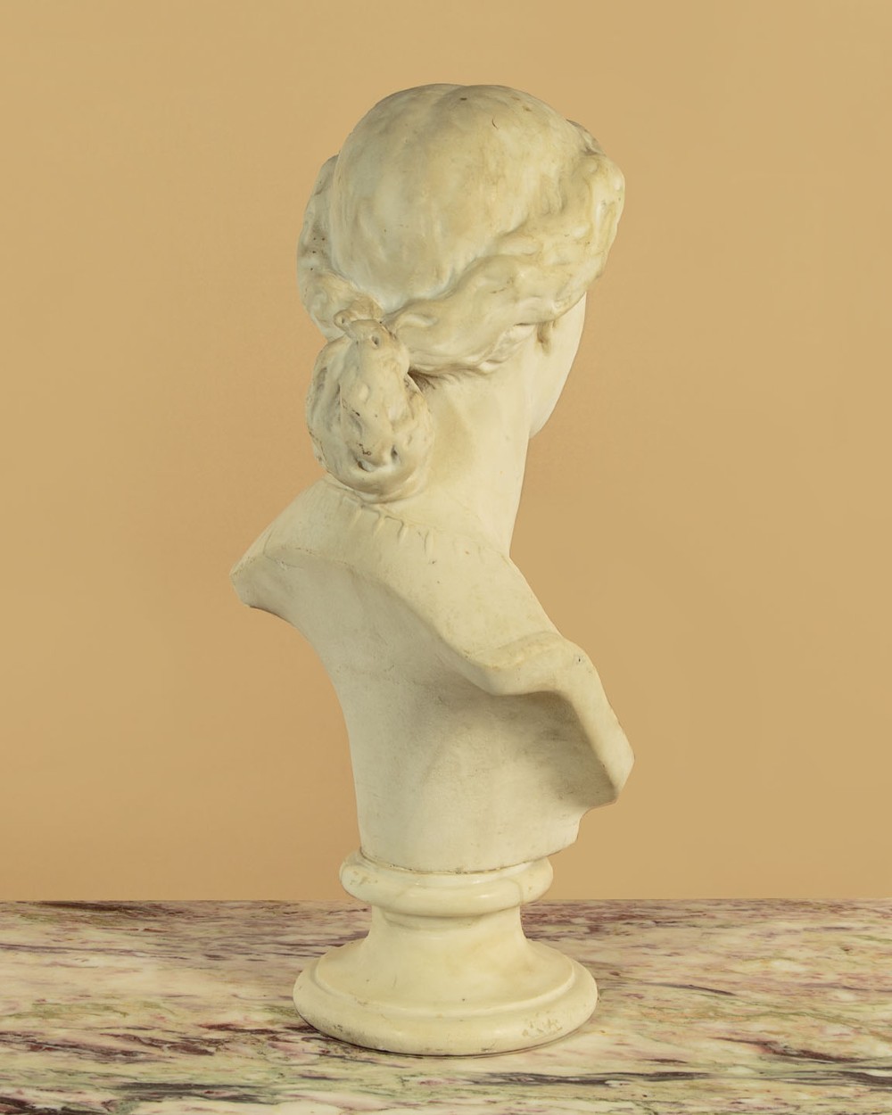 A carved off-white marble bust depicting the literary figure Cordelia set upon a turned pedestal base. View V