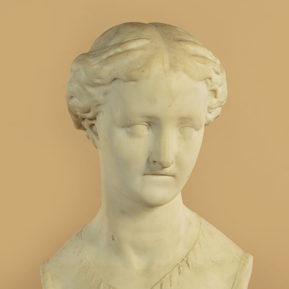 A carved off-white marble bust depicting the literary figure Cordelia set upon a turned pedestal base. View VI