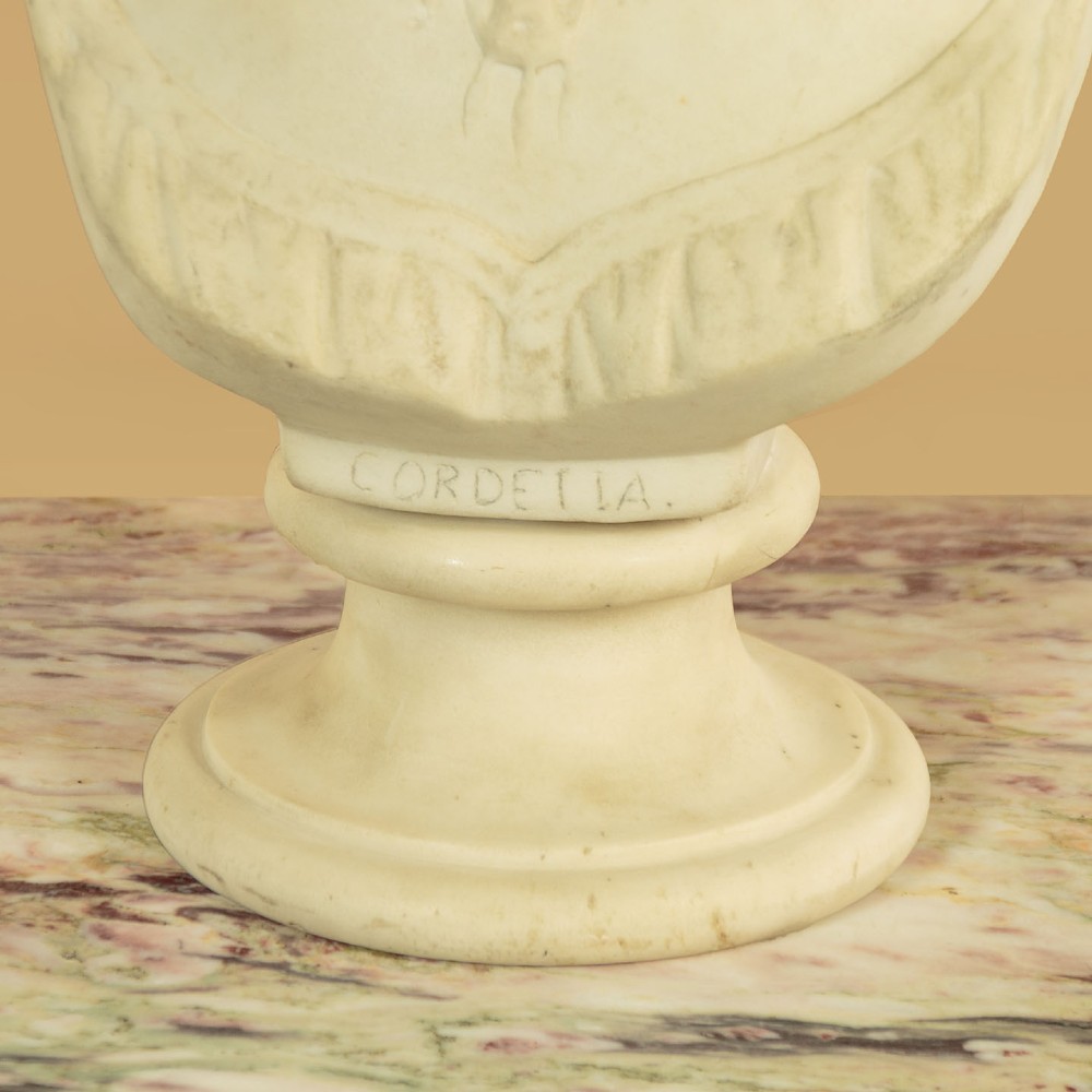 A carved off-white marble bust depicting the literary figure Cordelia set upon a turned pedestal base. View XI