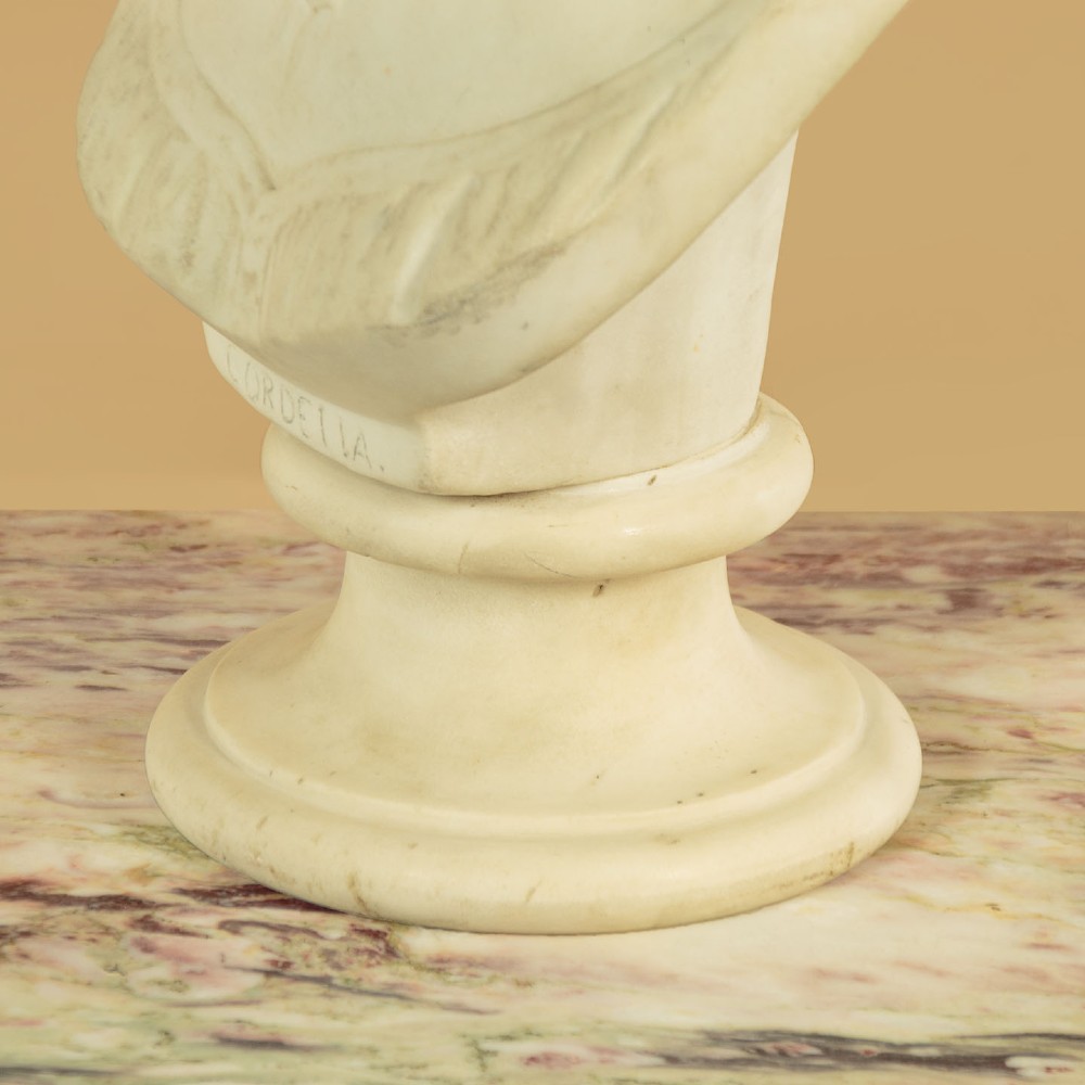 A carved off-white marble bust depicting the literary figure Cordelia set upon a turned pedestal base. View XII