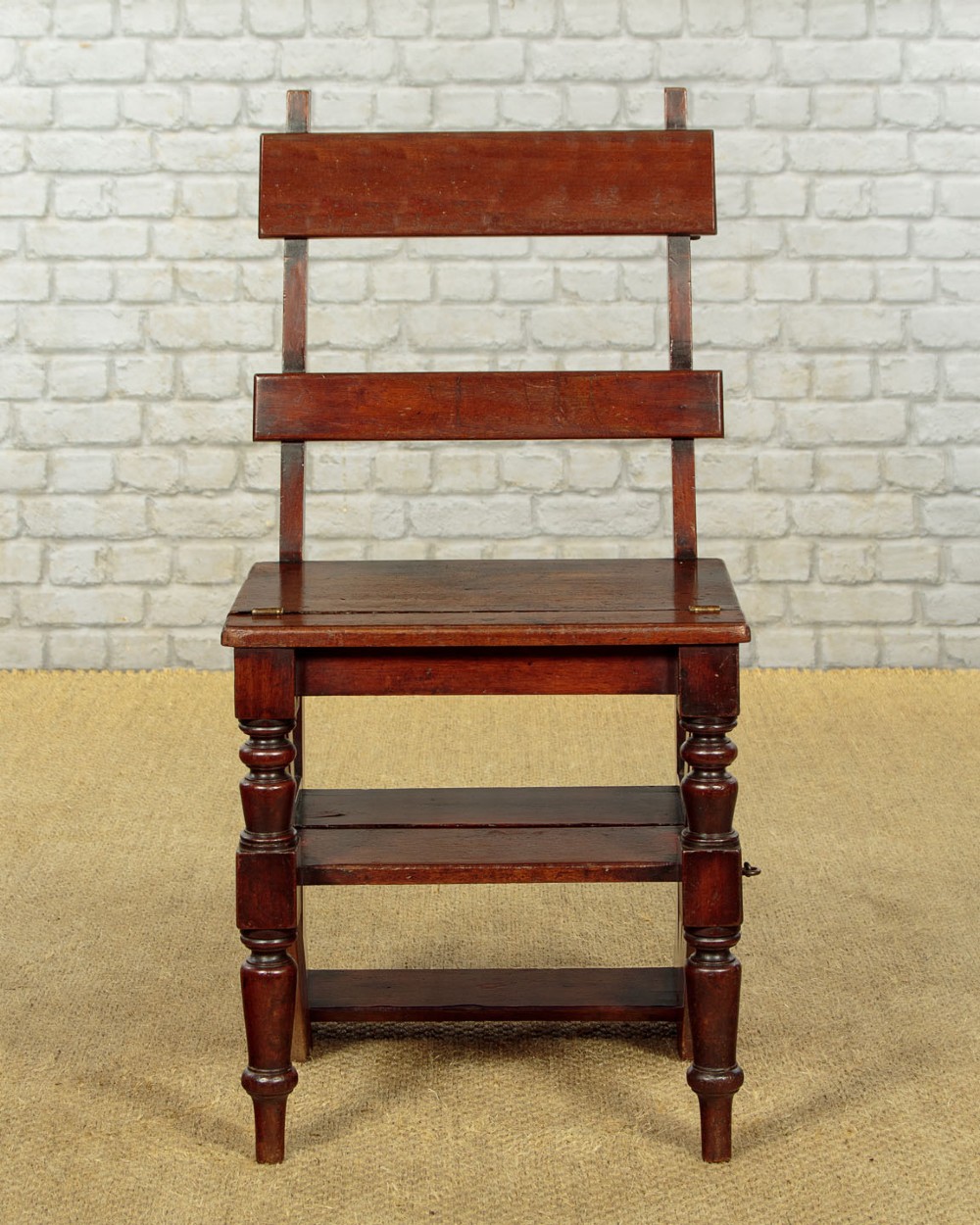 A late Victorian metamorphic mahogany side chair with turned front legs that folds open to convert into a short flight of library steps. View III
