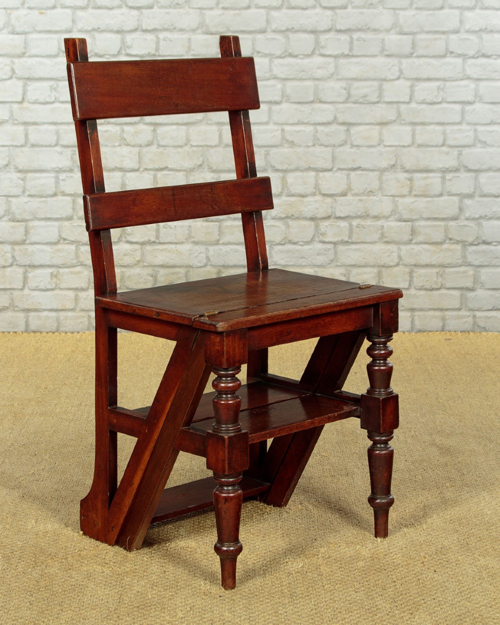 A late Victorian metamorphic mahogany side chair with turned front legs that folds open to convert into a short flight of library steps. View IV