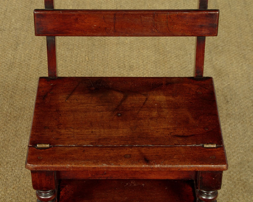 A late Victorian metamorphic mahogany side chair with turned front legs that folds open to convert into a short flight of library steps. View VII