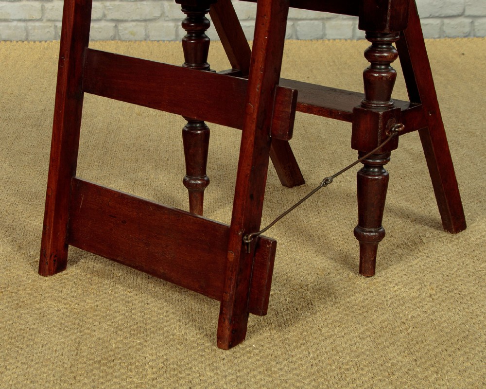 A late Victorian metamorphic mahogany side chair with turned front legs that folds open to convert into a short flight of library steps. View X