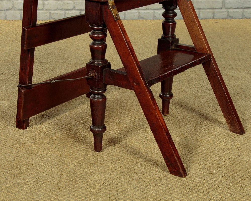 A late Victorian metamorphic mahogany side chair with turned front legs that folds open to convert into a short flight of library steps. View XI