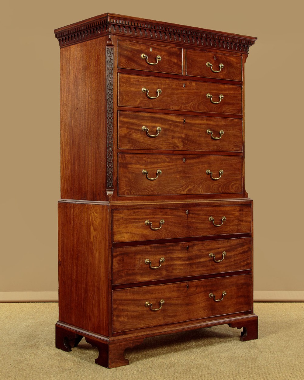 A Georgian mahogany chest on chest with two short over six long graduated drawers, featuring brass handles and bracket feet. View II