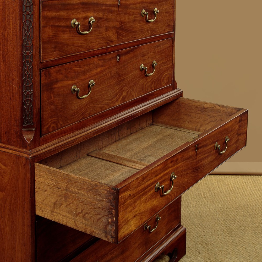 A Georgian mahogany chest on chest with two short over six long graduated drawers, featuring brass handles and bracket feet. View VII