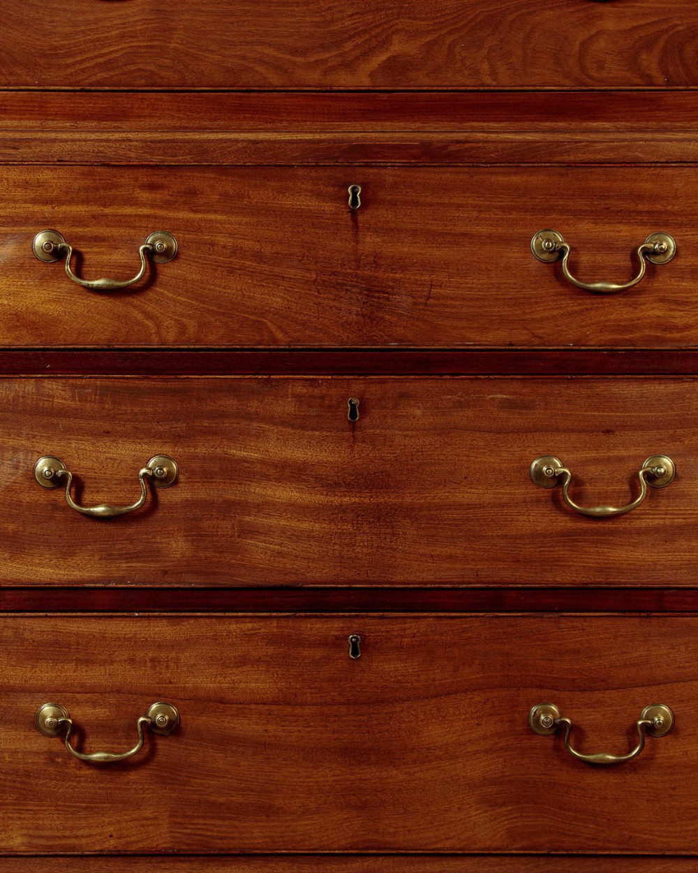 A Georgian mahogany chest on chest with two short over six long graduated drawers, featuring brass handles and bracket feet. View VIII