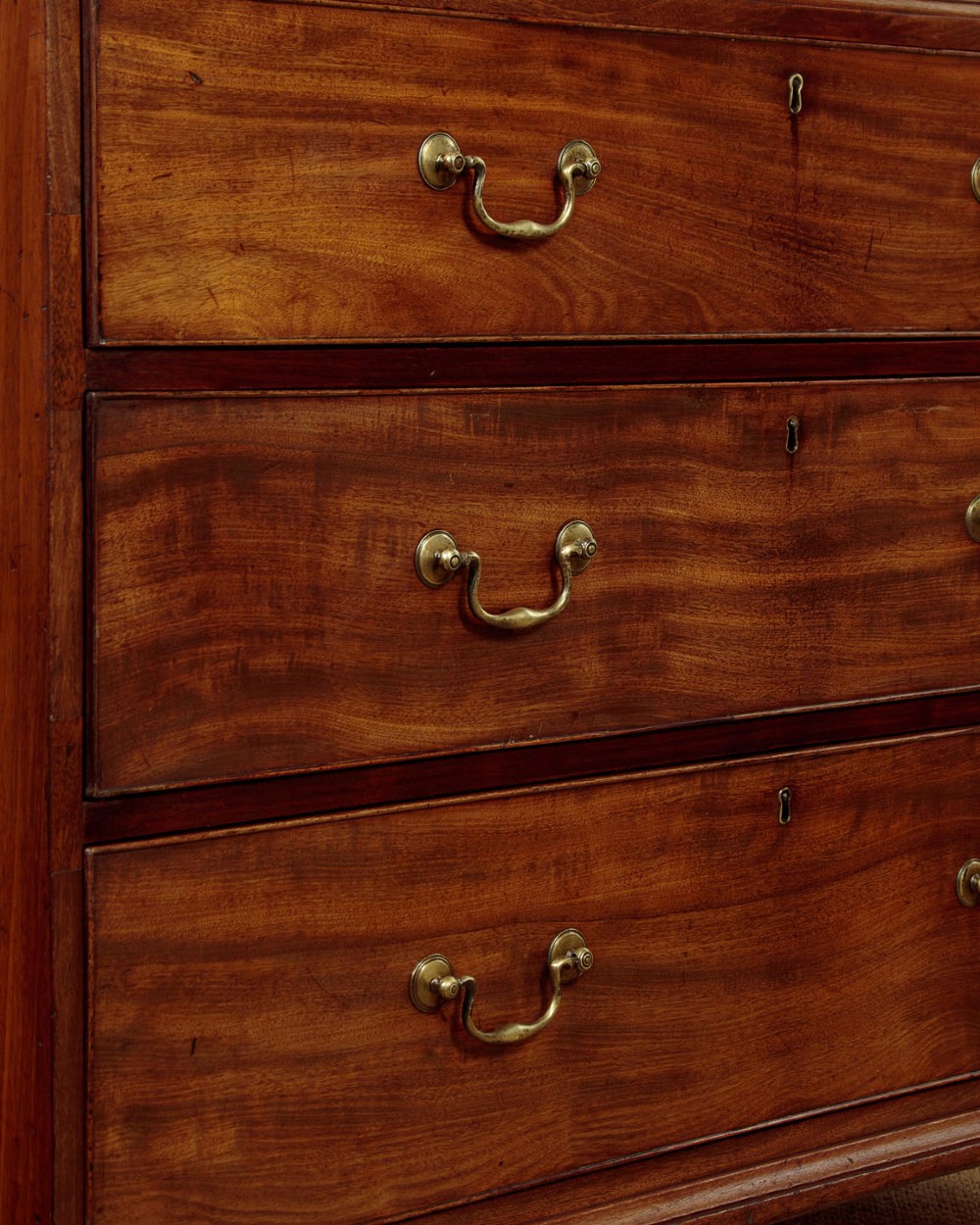 A Georgian mahogany chest on chest with two short over six long graduated drawers, featuring brass handles and bracket feet. View IX