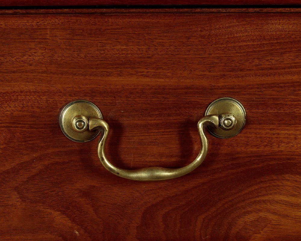 A Georgian mahogany chest on chest with two short over six long graduated drawers, featuring brass handles and bracket feet. View X