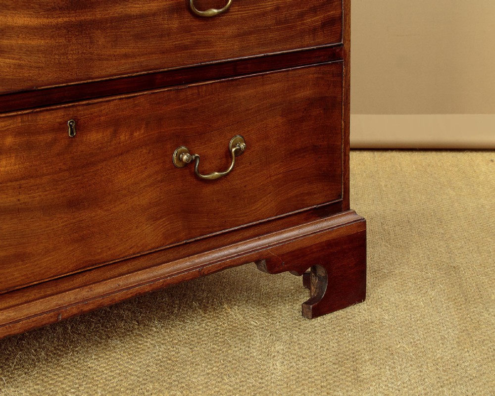 A Georgian mahogany chest on chest with two short over six long graduated drawers, featuring brass handles and bracket feet. View XI