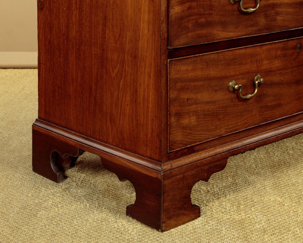 A Georgian mahogany chest on chest with two short over six long graduated drawers, featuring brass handles and bracket feet. View XII